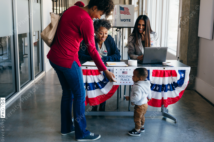 Volunteer helping citizen at polling place