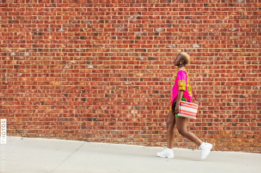 Young woman walks in the city