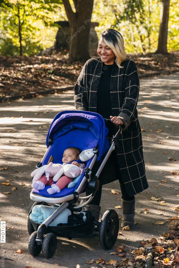 Mother and baby walking in park