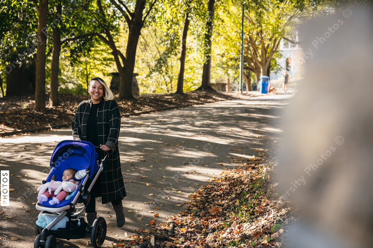 Mother and baby walking in park