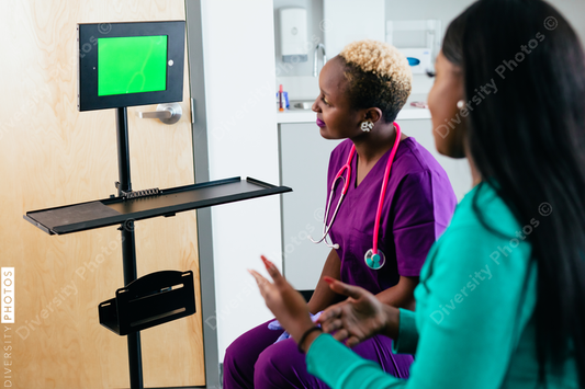 Black nurse and patient talks to virtual translator on video screen chat