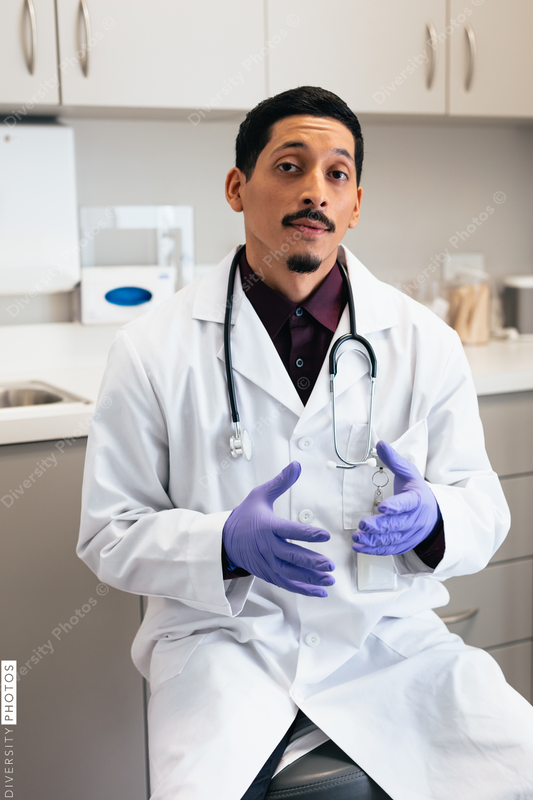 Doctor having a conversation with patient on exam room