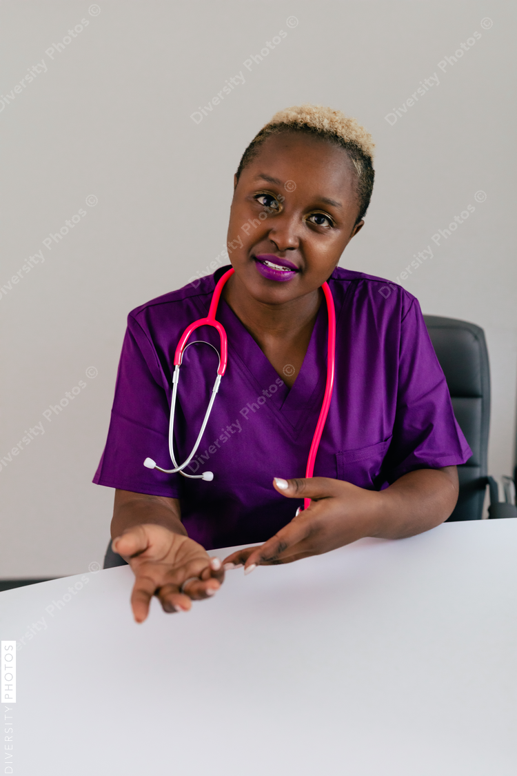 Black female triage nurse having a conversation with client - video chat screen insert