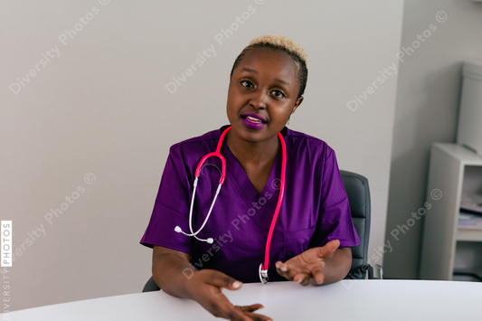Black female triage nurse having a conversation with client - video chat screen insert
