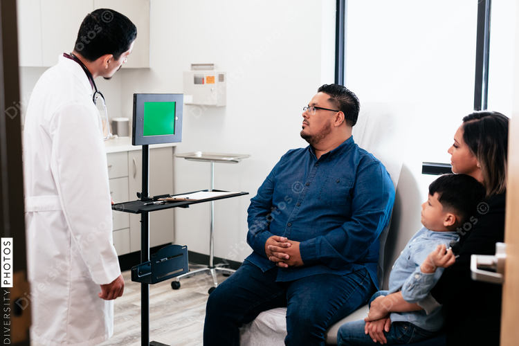 Doctor discussing results with hispanic family and virtual medical healthcare provider specialist