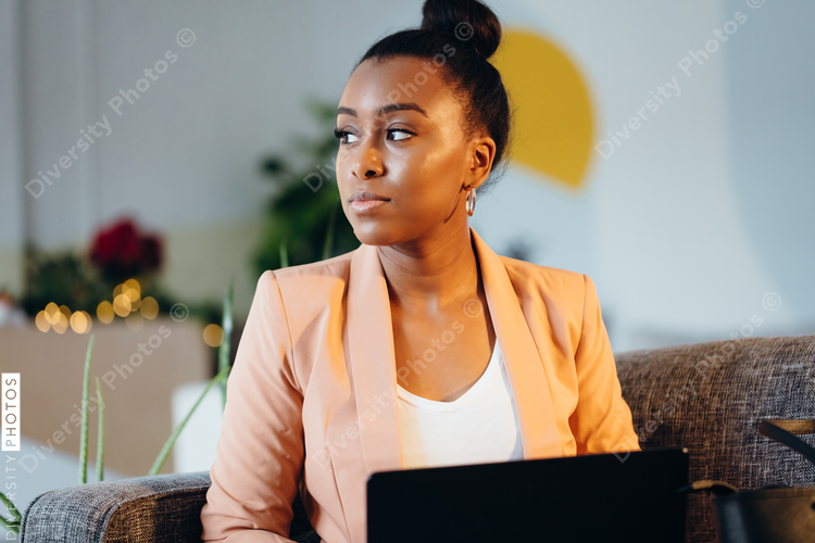 Young professional woman working at modern business office
