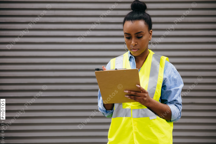Warehouse owner checking off inventory list