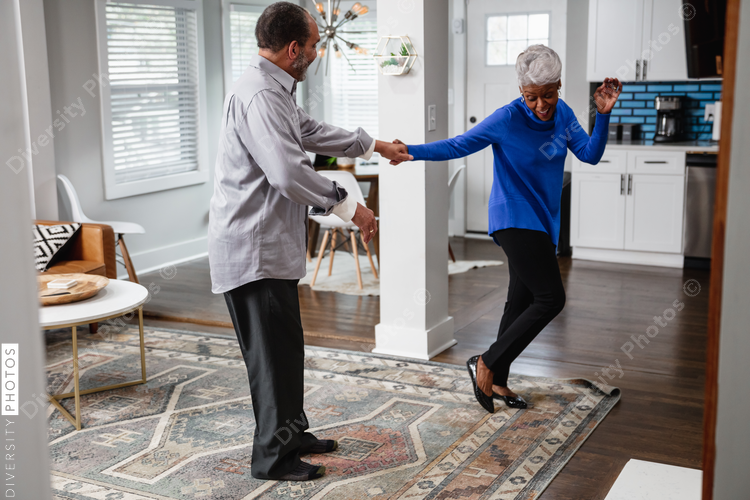 Active lifestyle, senior couple dances at home
