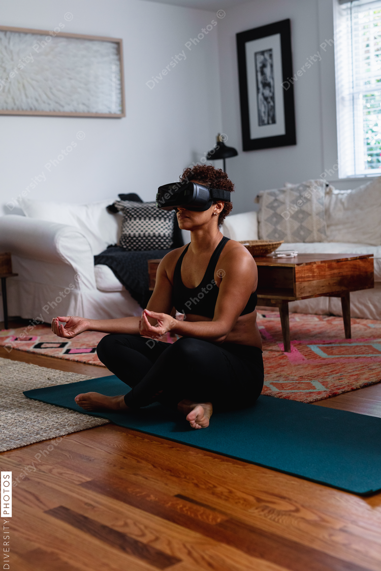 Black woman does meditation virtual reality exercise