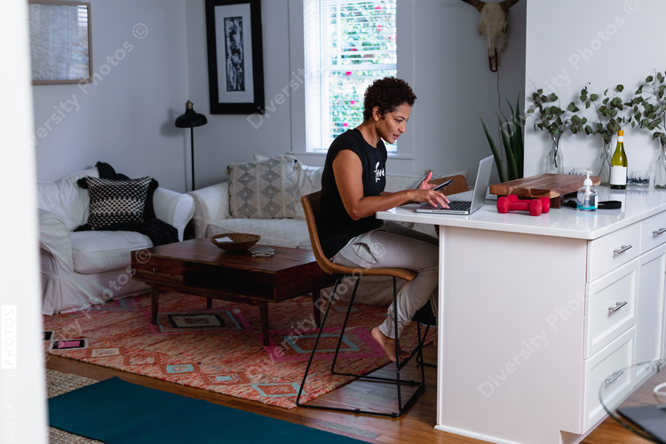 Professional Black woman working remotely from home, freelance consultant