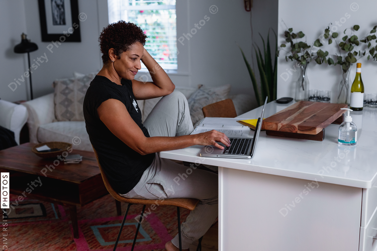 Creative woman works from home remotely using laptop