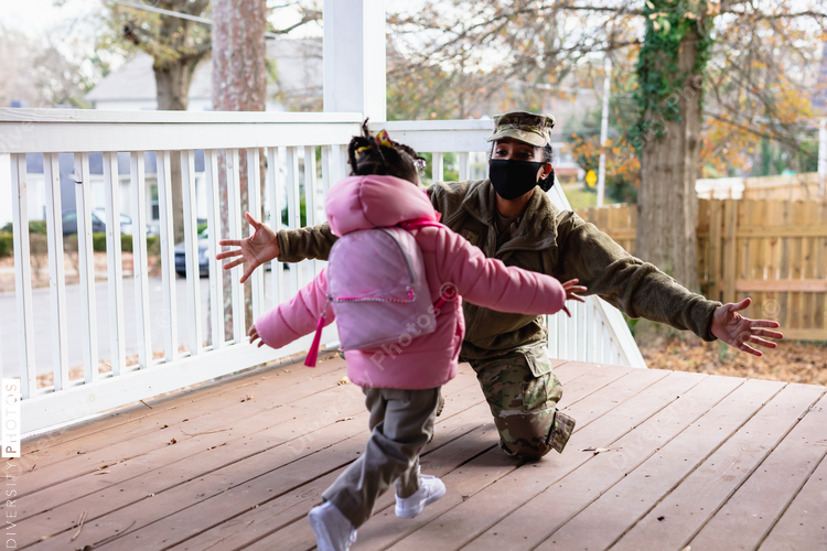 Daughter greets mother returning home, soldier