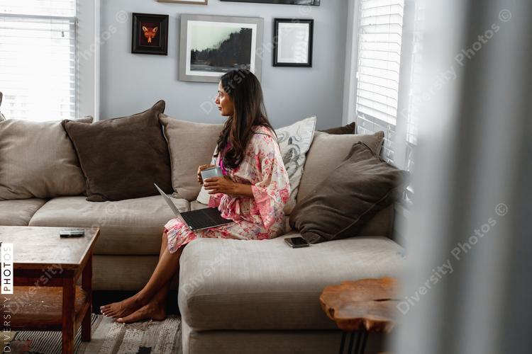 Professional Indian woman works remotely from home in comfortable house clothes