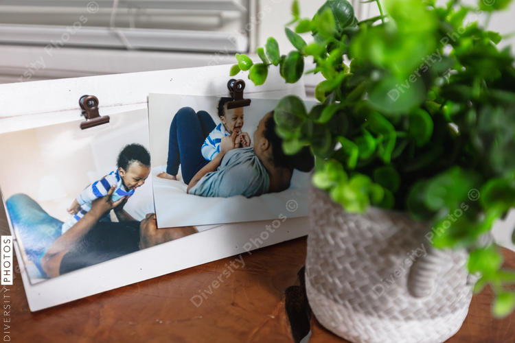 Family photos framed on living room table stand