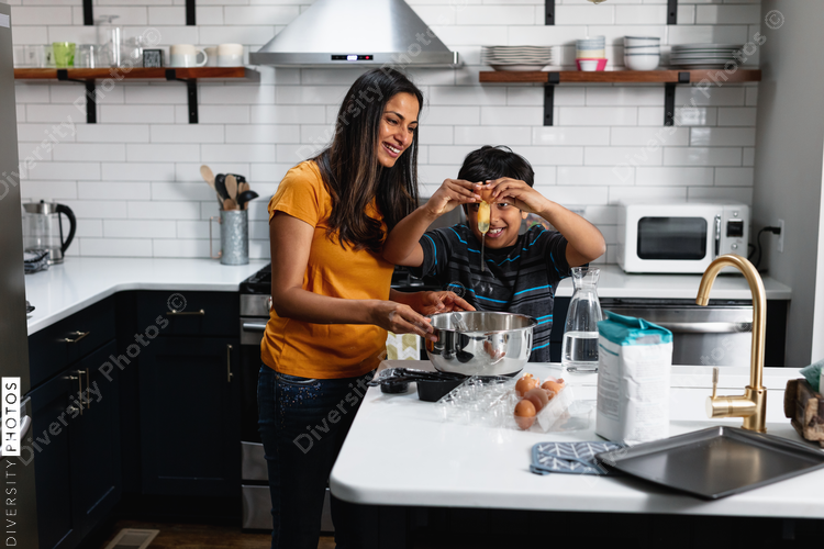 Indian mom and son cooking and baking in the kitchen