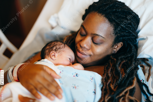 Black mother and son bonding with skin to skin time