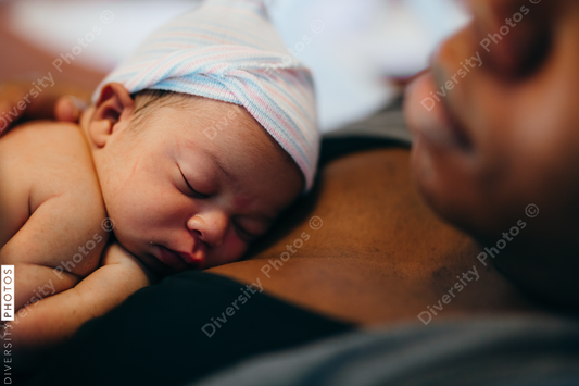Black mother and son bonding with skin to skin time