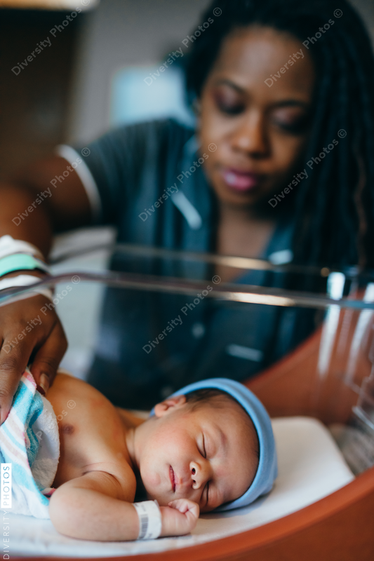 Black mom checks on newborn son at hospital 