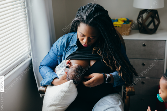 African American mother breastfeeding baby
