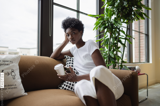 Black Business woman sitting on sofa in office