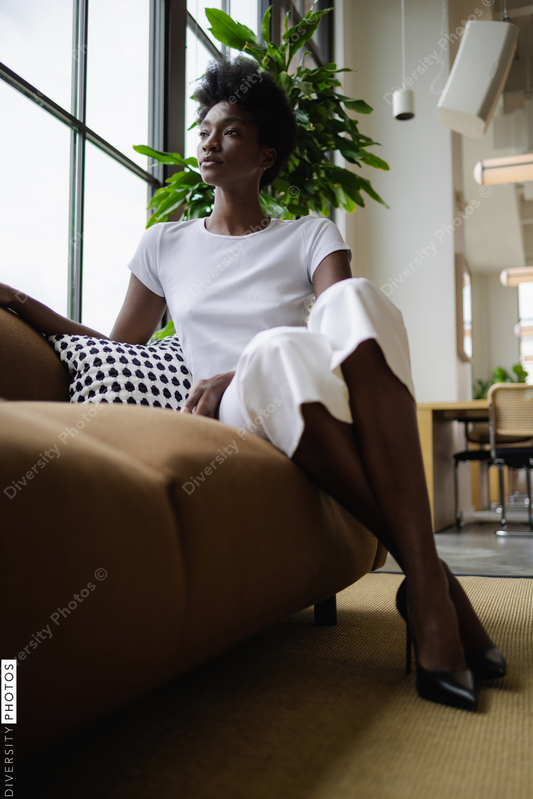 Black Businesswoman sitting on sofa in office