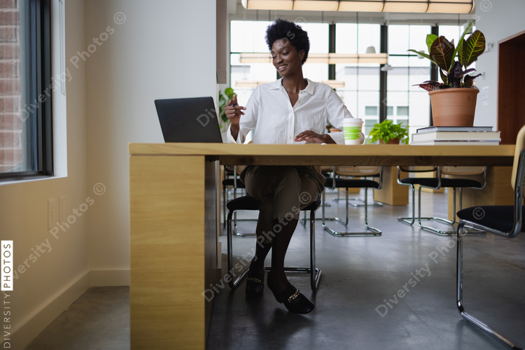 Business woman with laptop in office