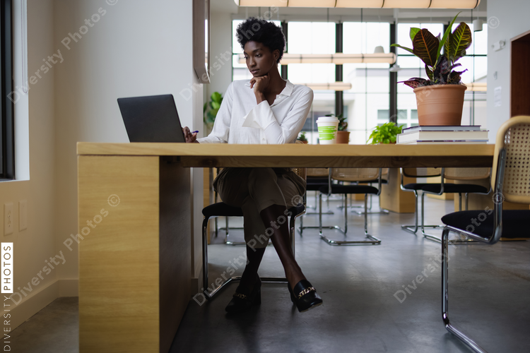 Business woman with laptop in office