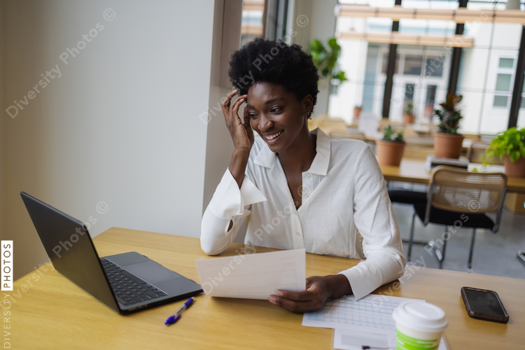 Business woman with laptop in office