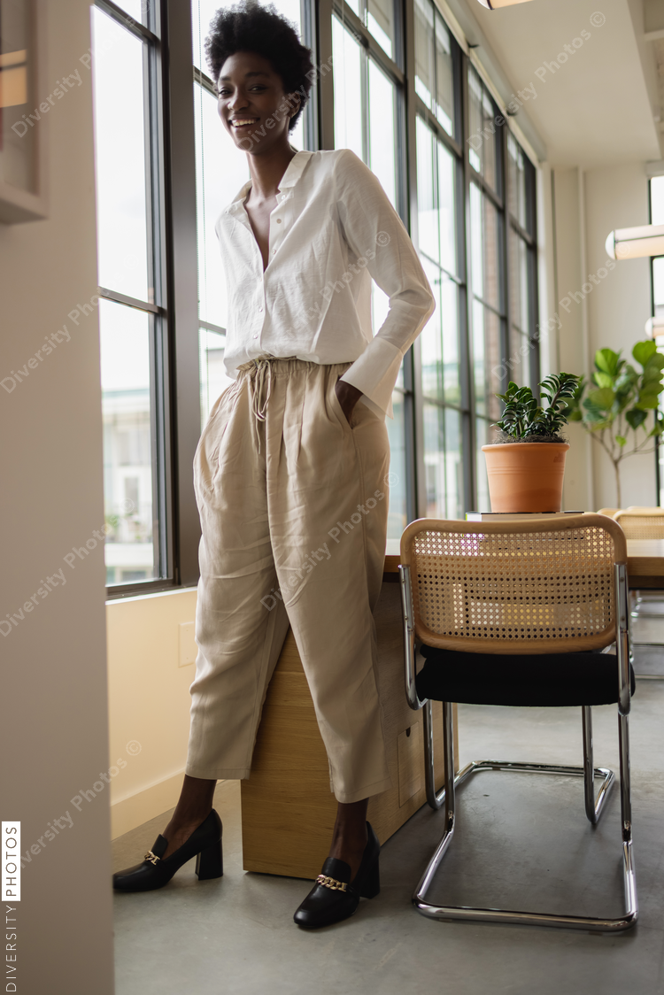 Portrait of business woman in office lounge area