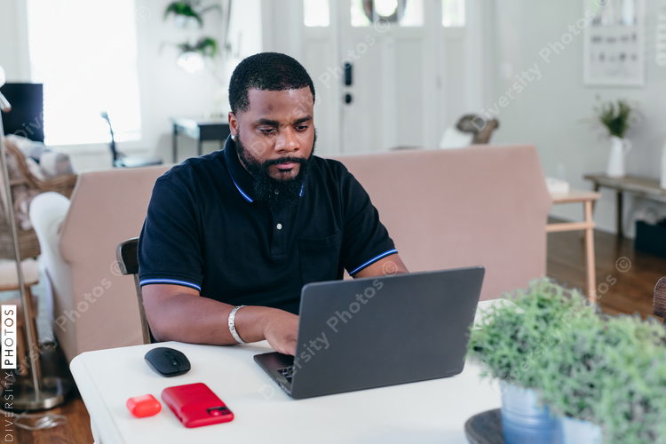Black man on video chat, remote work