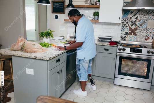 Black man in kitchen preparing healthy meal