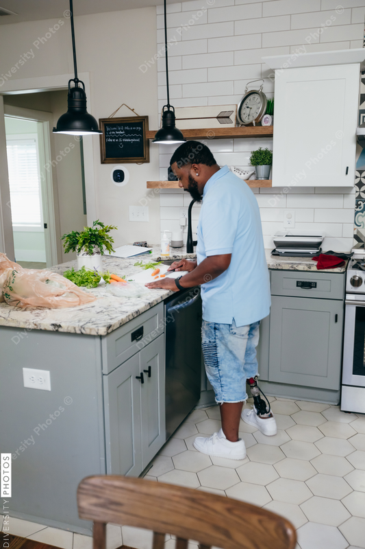 Black man in kitchen preparing healthy meal