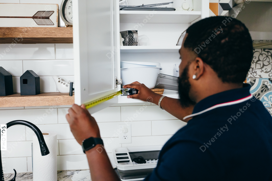 Black man with prosthetic leg DIY, repairing things around the house