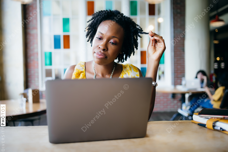 Black woman on video call at cafe