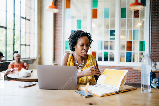 African American woman working at a local cafe