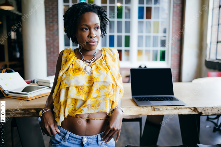 Portrait beautiful thoughtful young businesswoman in coworking space, African American woman