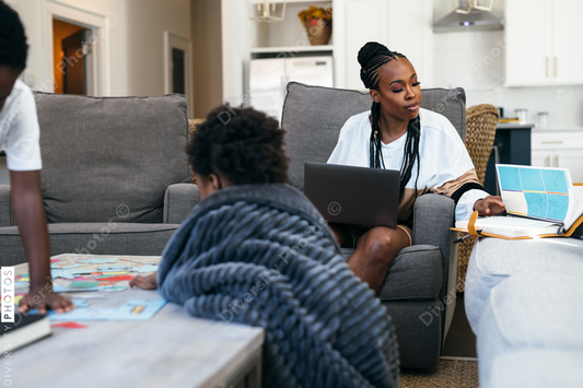 Black kids playing board games, puzzle, at home, while mom is working