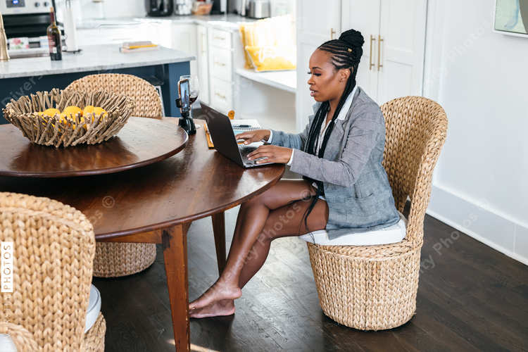 Black woman working from home on virtual meeting video chat