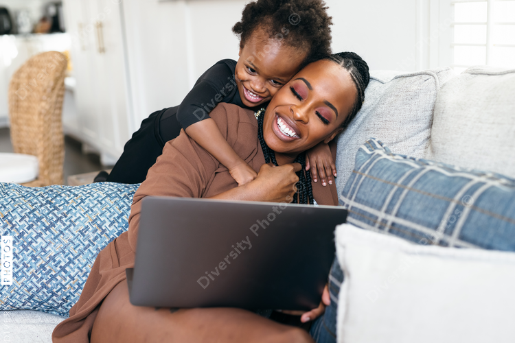 Black mother and daughter have bonding moment at home, connectedness 