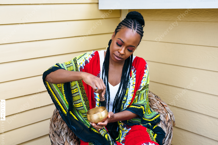 Black woman using soothing sound bath
