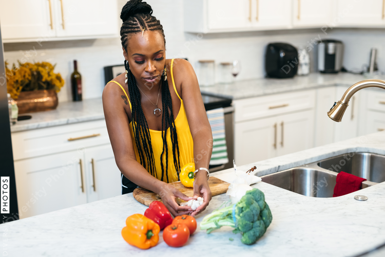 Woman prepares dinner for family, healthy meal, kitchen