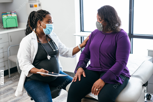 Black doctor consulting with senior patient about lab results, connection 