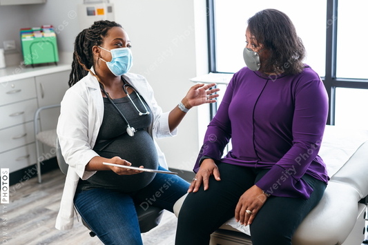 Black doctor consulting with senior patient about lab results, connection 