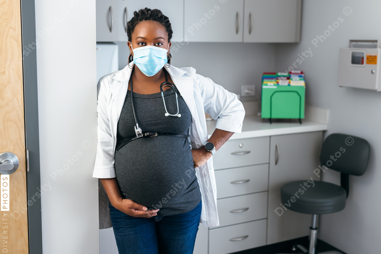 Portrait of Black female pregnant doctor, healthcare professional