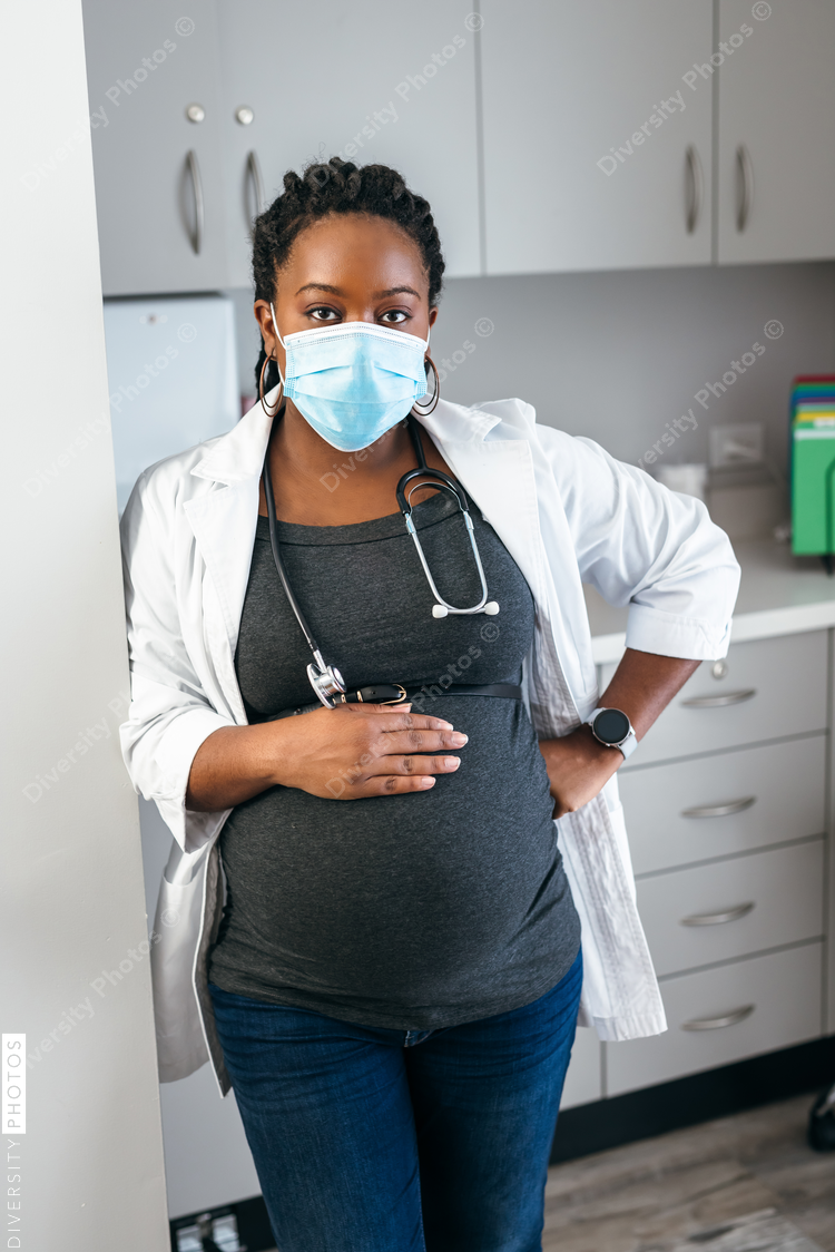 Portrait of Black female pregnant doctor, healthcare professional