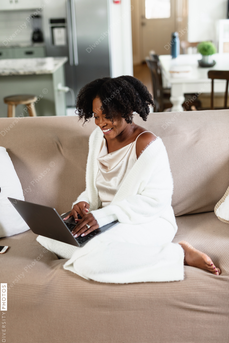 Black woman cozy, working from home