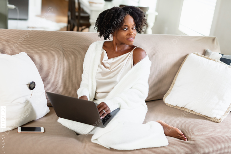 Black woman cozy, working from home