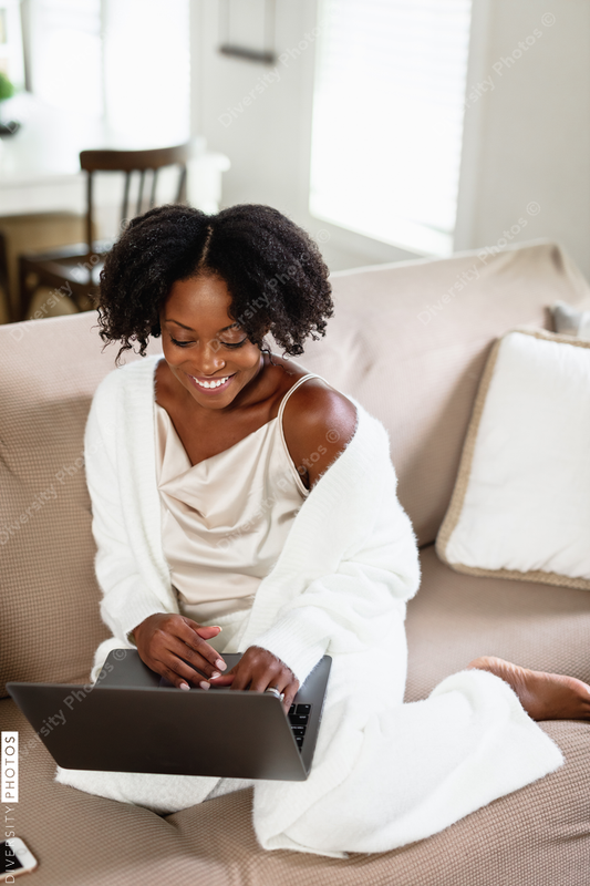 Black woman cozy, working from home