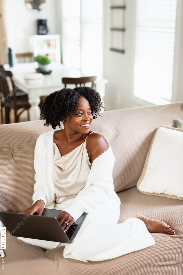 Black woman cozy, working from home