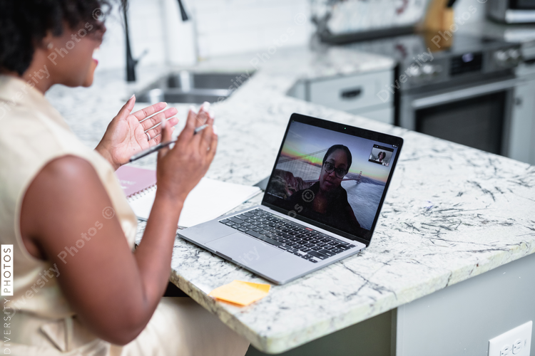 Black woman having video chat with client consultant 